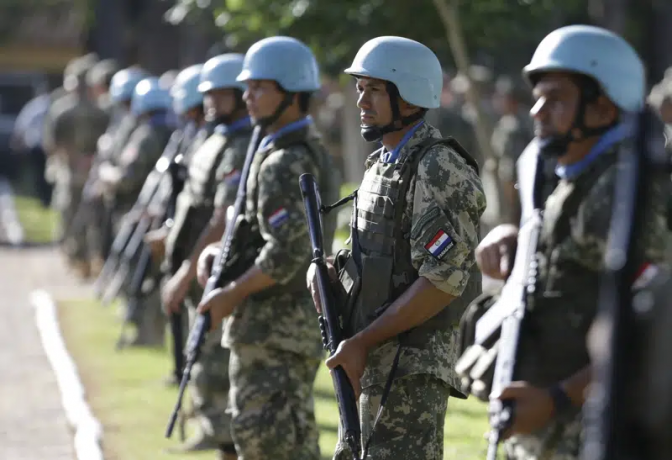 FILE - Soldiers line up at the United Nations Peace Operations Training Center (CECOPAZ) before the arrival of United Nations Secretary-General Ban Ki-Moon in Asuncion, Paraguay, on Feb. 26, 2015. AP/RSS Photo
